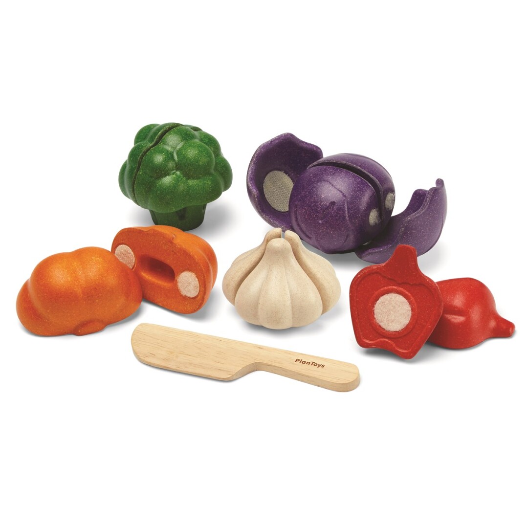 Set de vegetales de madera para cortar de Plan Toys: calabaza, pimiento, ajo, brócoli y col lombarda
